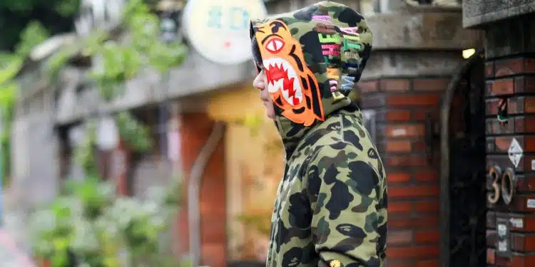 Close-Up Shot of a Person Wearing Bape Shark Hoodie